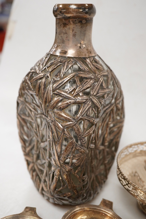 A Chinese sterling mounted dimpled glass decanter, with bamboo decoration, lacking stopper, approx. 19.5cm, together with a George V silver pedestal bonbon bowl, a pair of silver tea strainers by Roberts & Belk and a pai